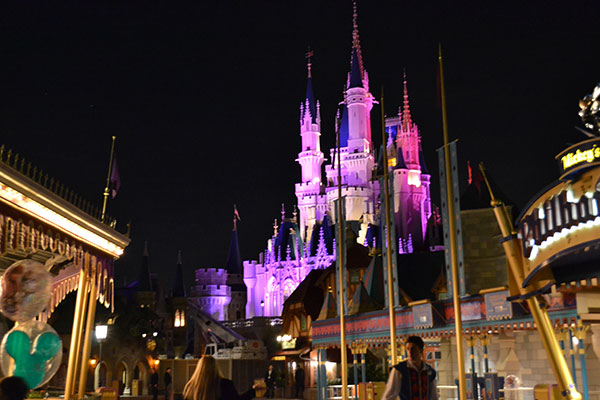 Cinderella Castle shines at night in The Magic Kingdom.