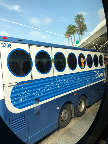 A side view of Disney's Magical Express at Walt Disney World