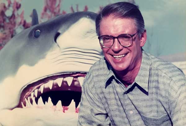 Jay Stein of MCA poses next to the Jaws shark from the attraction.