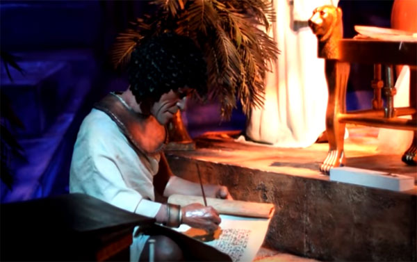 A scribe writes down the proclamation of the pharaoh in Spaceship Earth at Epcot in Walt Disney World. 
