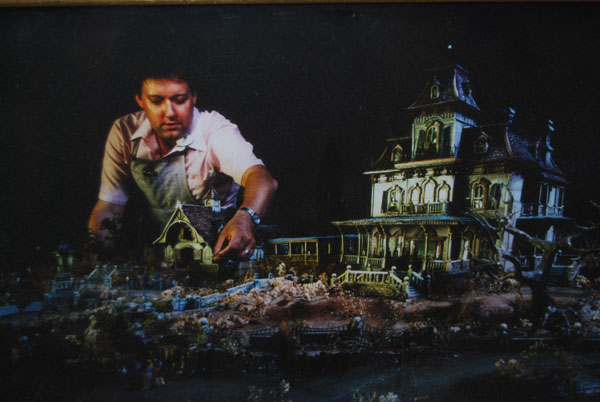 Former Disney Imagineer Bob Baranick works on his model for Phantom Manor at Disneyland Paris.