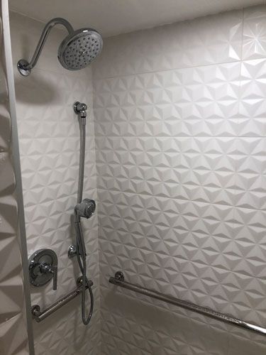 The shower at the refurbished rooms in Disney's value resorts are different than the previous tub set-up.