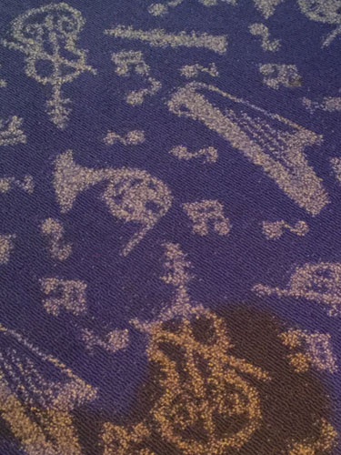 The carpet at Mickey's Philharmagic is just one of many cool details in the queue area.