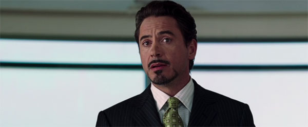Tony Stark reveals his secret identity in the press conference at the end of the first MCU movie.