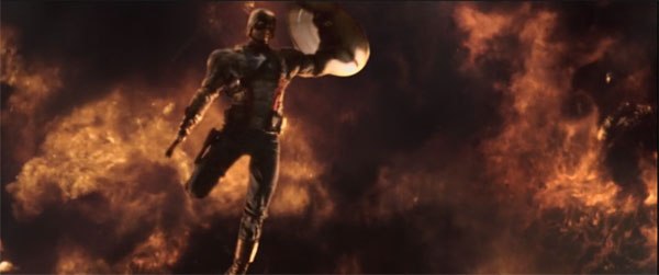 Chris Evans as Captain America leaps away from a massive explosion while battling enemy soldier.