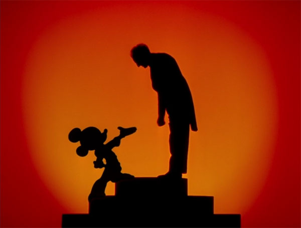 Mickey talks to composer Leopold Strokowski in the Disney 1940 film Fantasia.