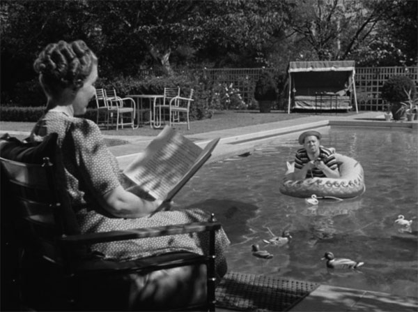 Robert Benchley shoots ducks in the pool while his wife reads The Reluctant Dragon.