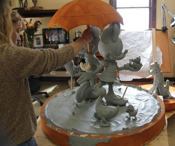 Valerie Edwards works on sculpting Mickey and Minnie for area development at Walt Disney Imagineering.