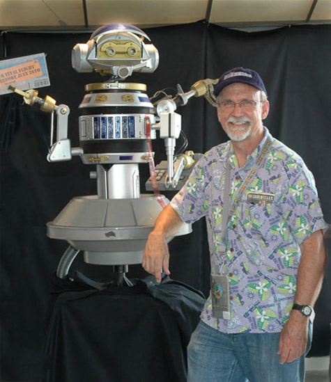 Former Disney Imagineer Chris Runco poses with his design for the RX-24 robot for Star Tours.