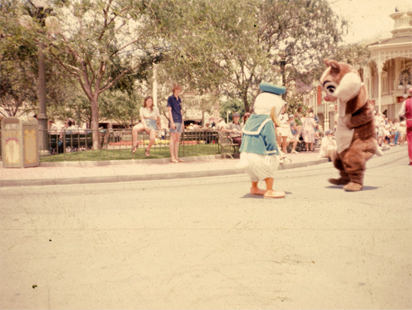 Chip and Donald Duck have a standoff in Main Street, U.S.A in 1975.