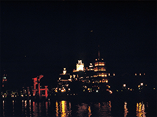 A nighttime shot of World Showcase in 1984, including The American Adventure and Japan pavilion at EPCOT Center.