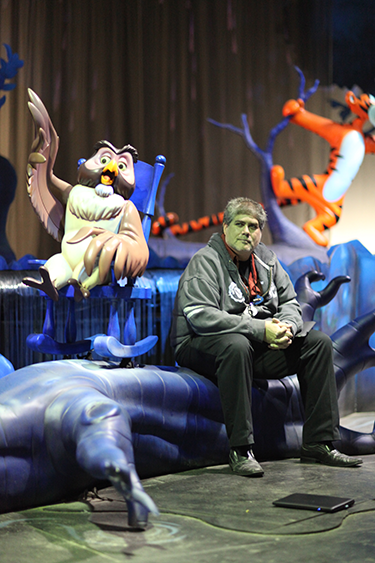 Imagineer Scott Rogers takes a break with characters from Winnie the Pooh.