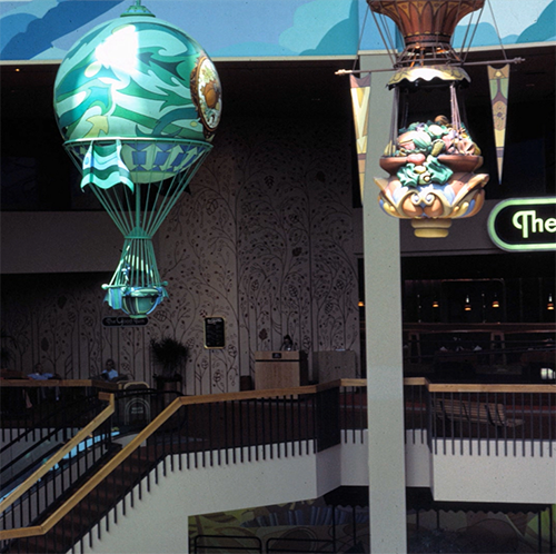 The Land Pavilion in 1984 with The Good Turn restaurant and balloons floating inside it.