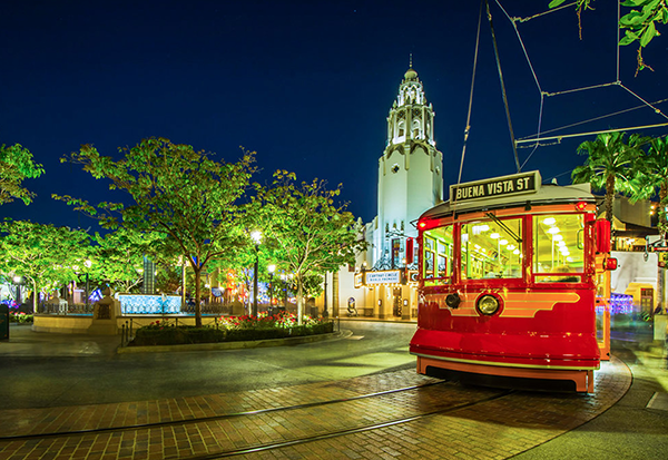The Red Car Trolley and Carthay Circle Restaurant look charming at night at Disney California Adventure.