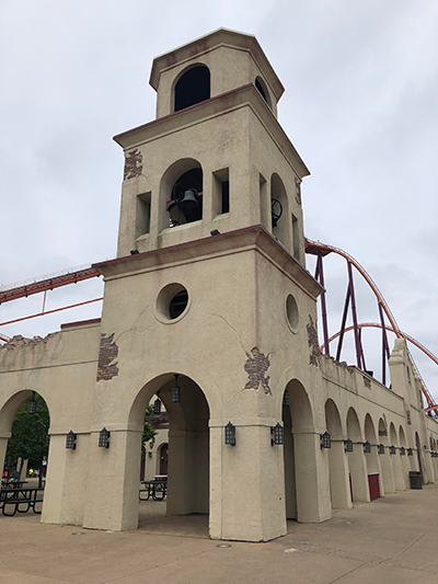 Raging Bull looms behind this depiction of a Spanish mission at Six Flags Great America.