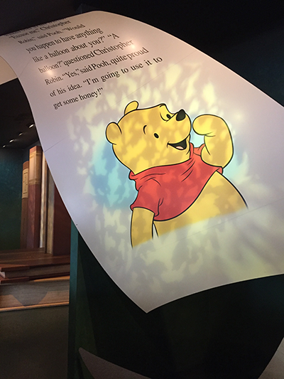 A storybook page from the inside of The Many Adventures of Winnie the Pooh at The Magic Kingdom. 
